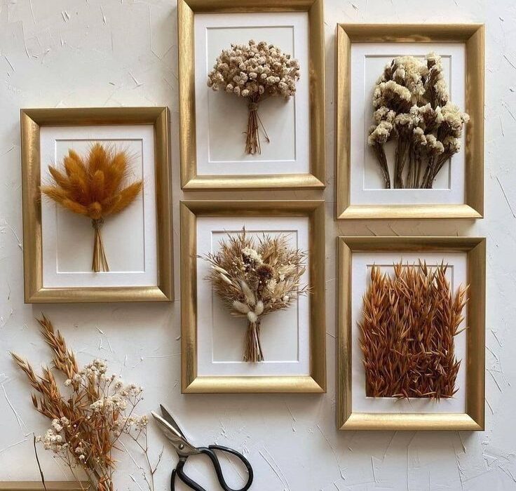 Beautiful dried flower frame decor on home entrance wall