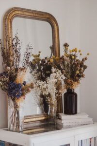 beautiful dried flower vases near the mirror